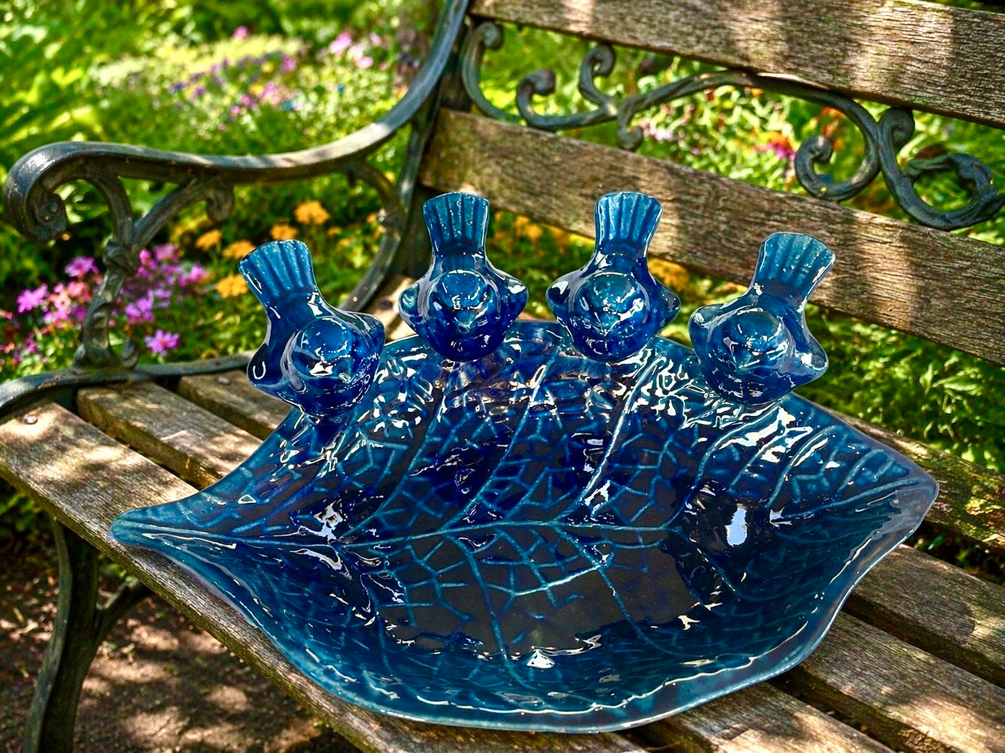 Blue ceramic bird feeder